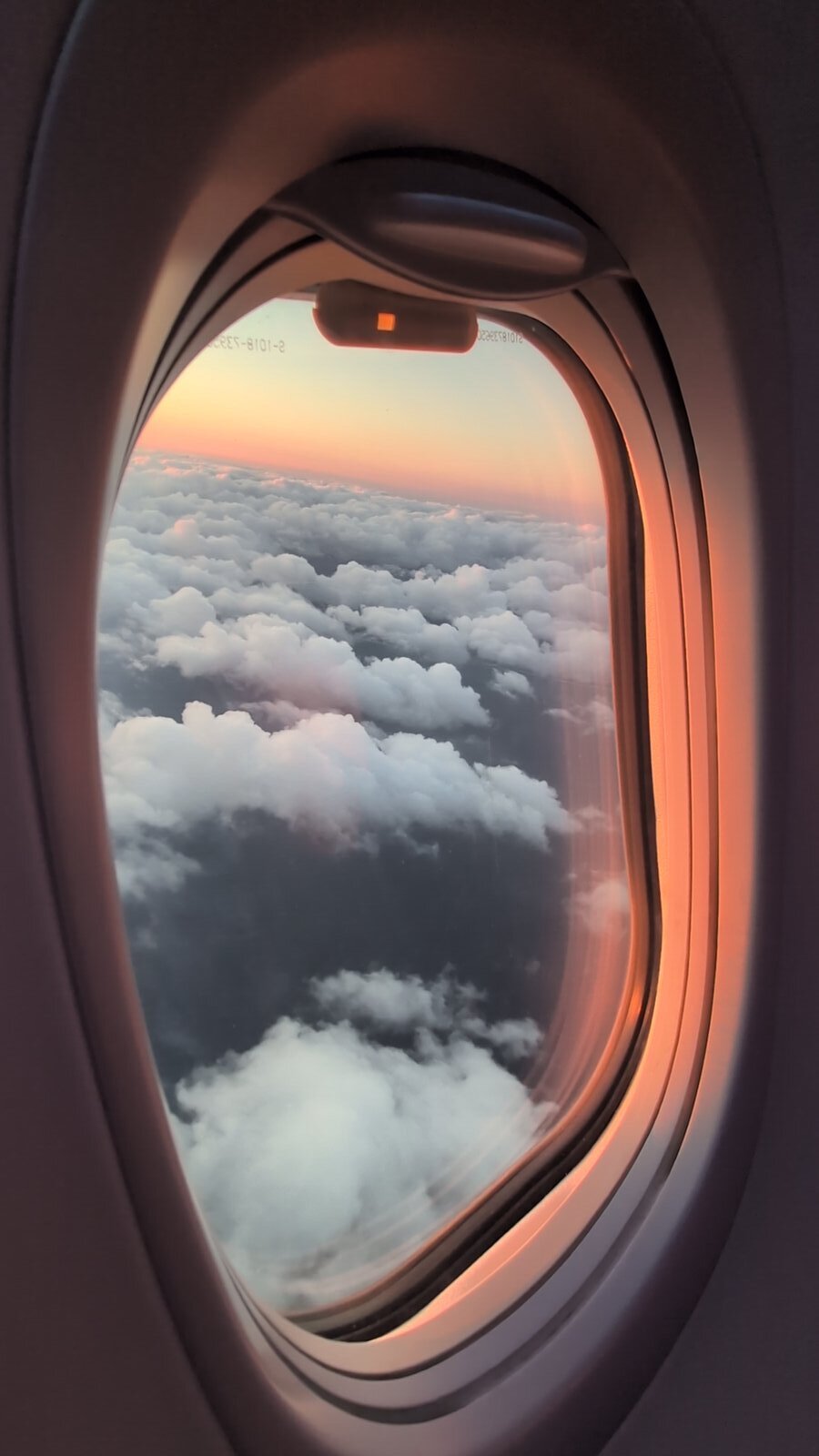 Clouds through airplane window